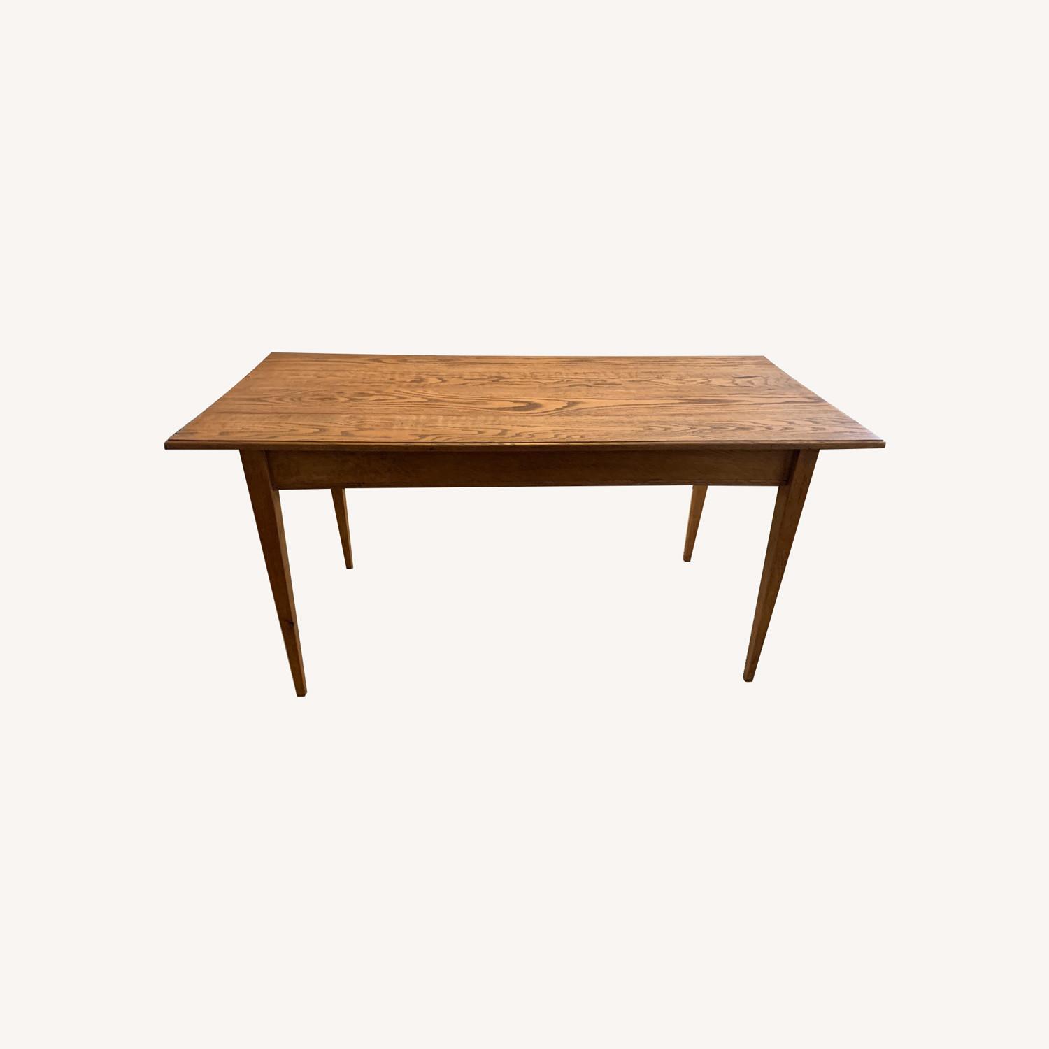 Handcrafted Solid Wood Dining Table - AptDeco