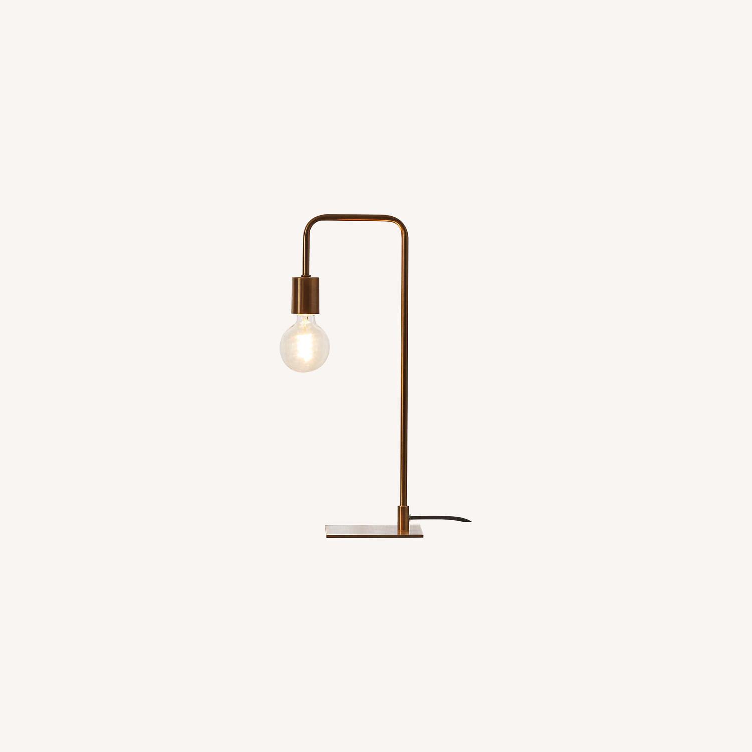 CB2 antique brass arc table lamp AptDeco