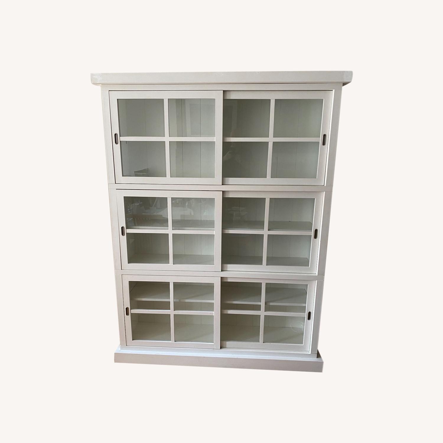 Crate & Barrel White Bookcase With Glass Sliding Doors AptDeco