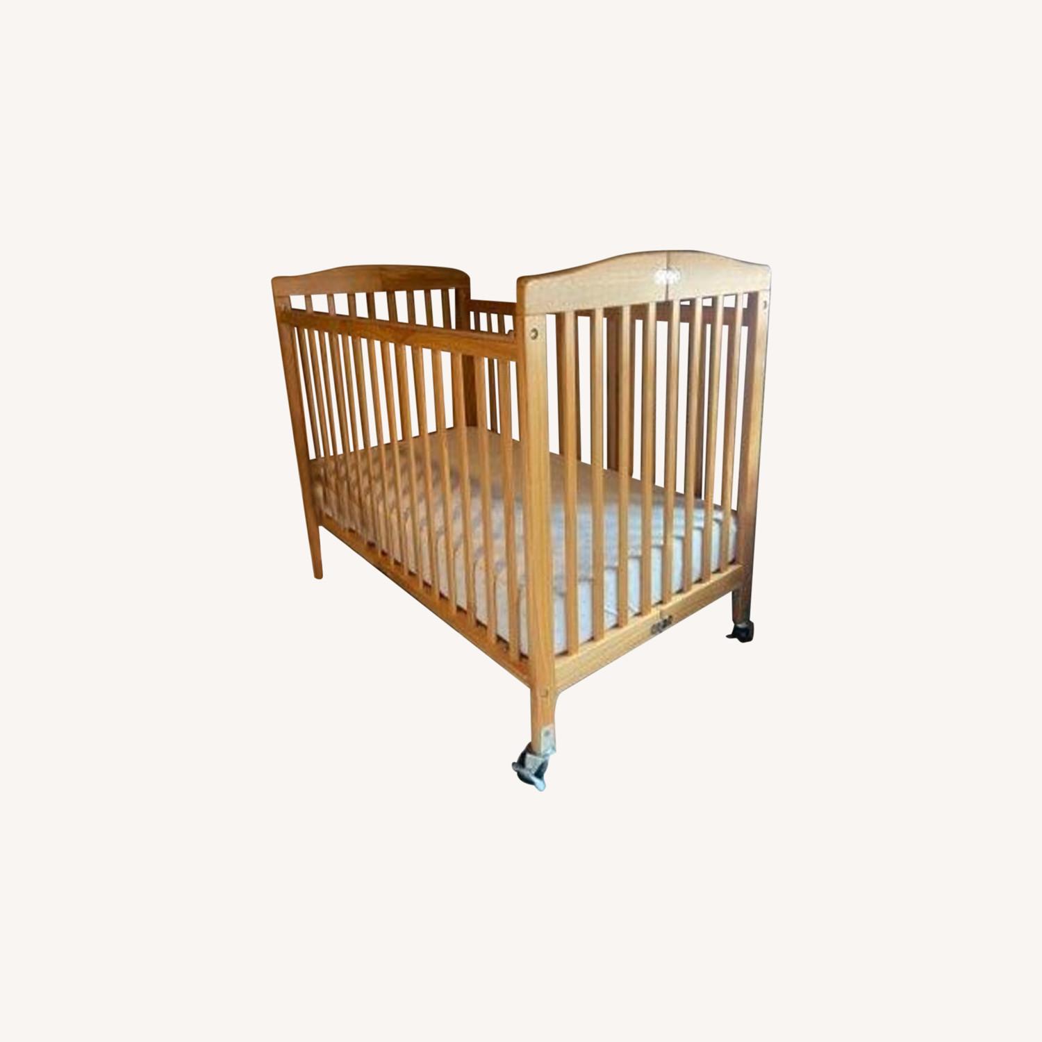 L.A Baby Folding Wood Crib AptDeco