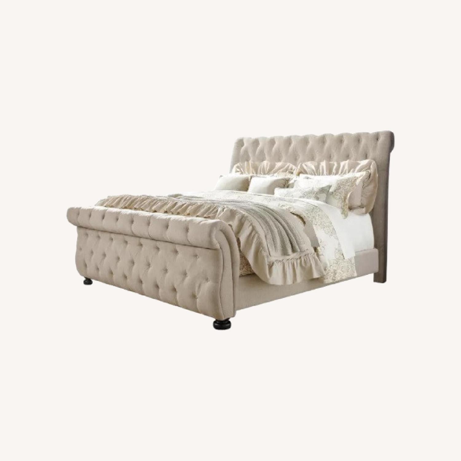 Raymour & Flanigan Queen Upholstered Tufted Sleigh Bed AptDeco