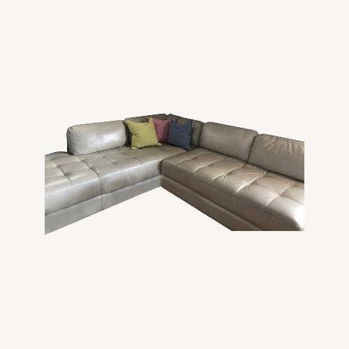 Used Platinum Leather Sectional for sale on AptDeco