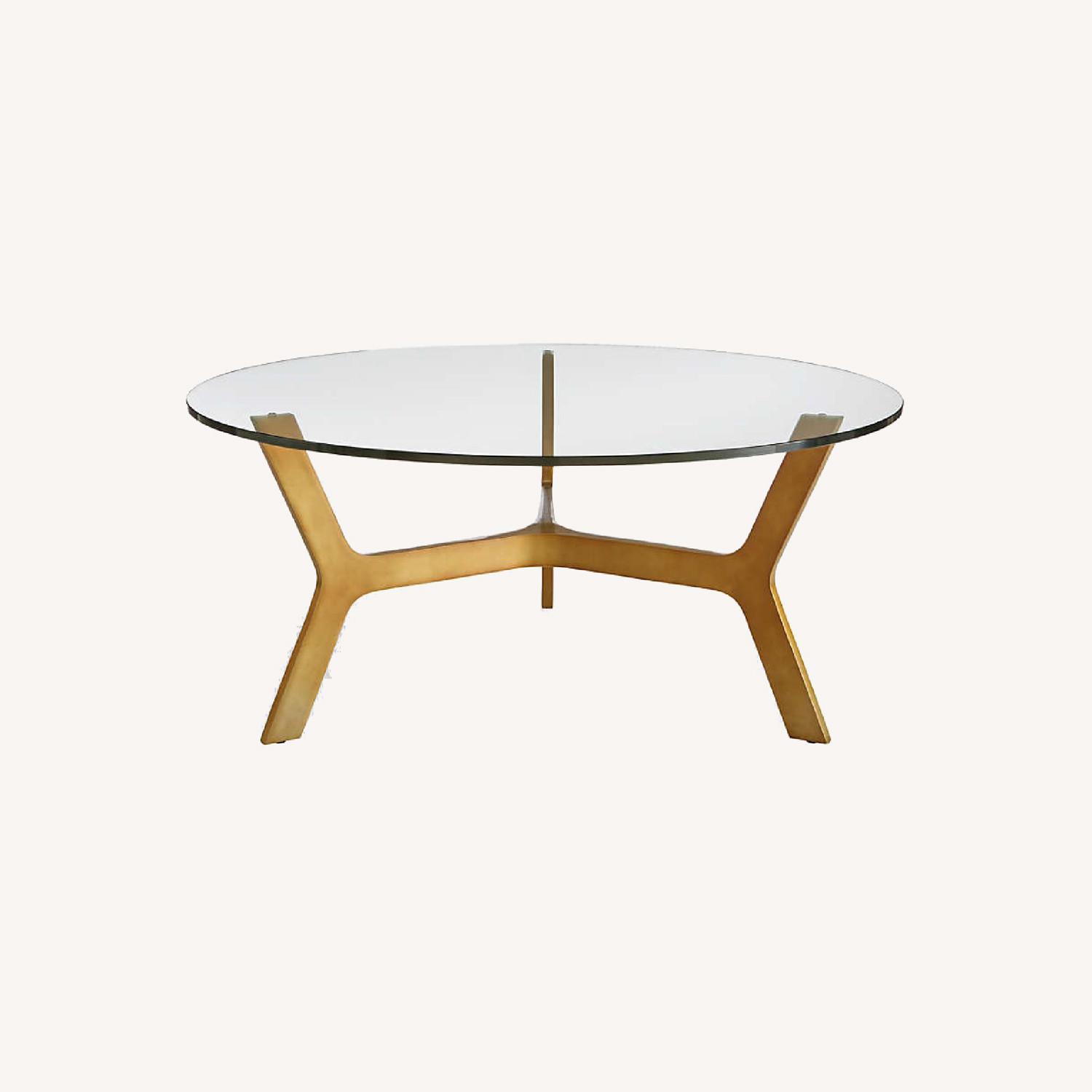 Crate & Barrel Round Glass Coffee Table with Brass Base AptDeco