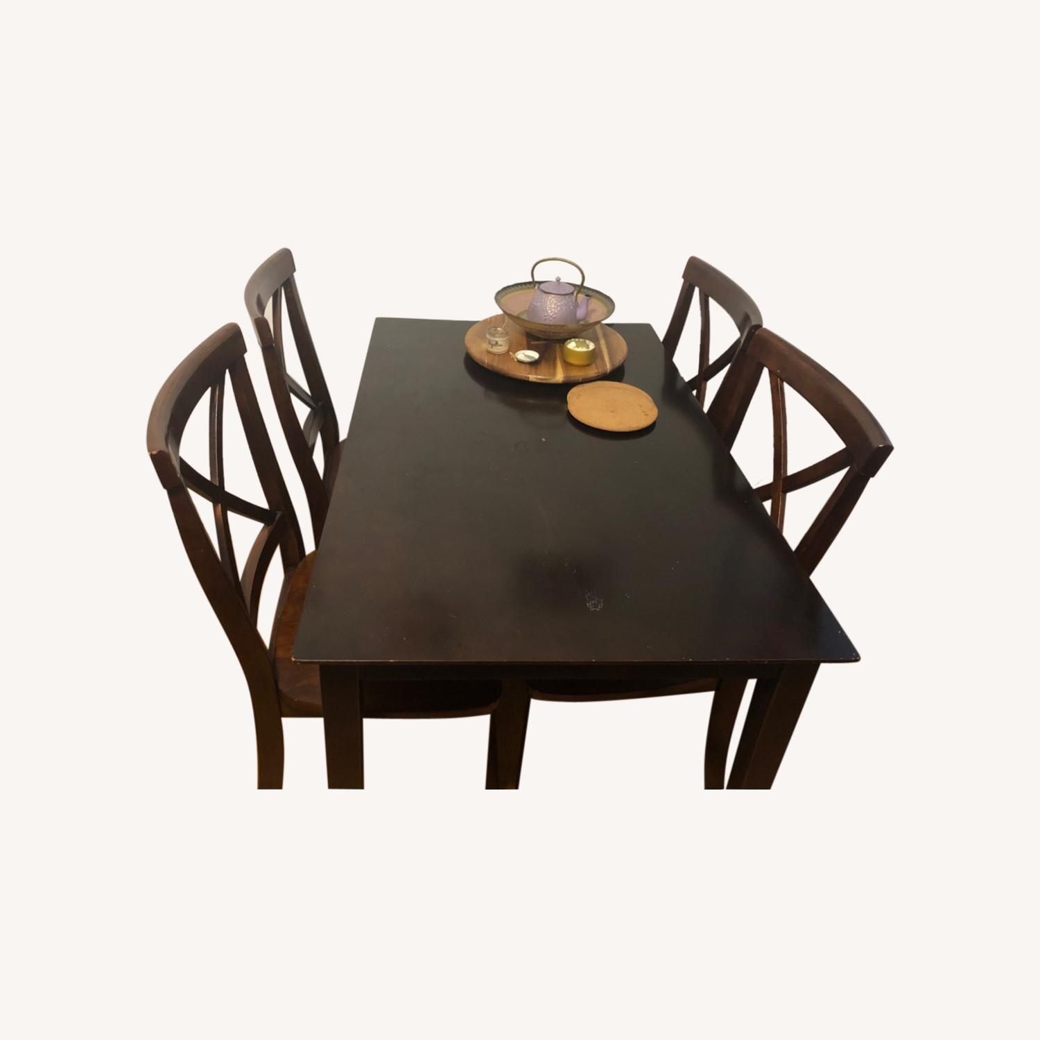 Dark Wood Table and Four Chairs - AptDeco