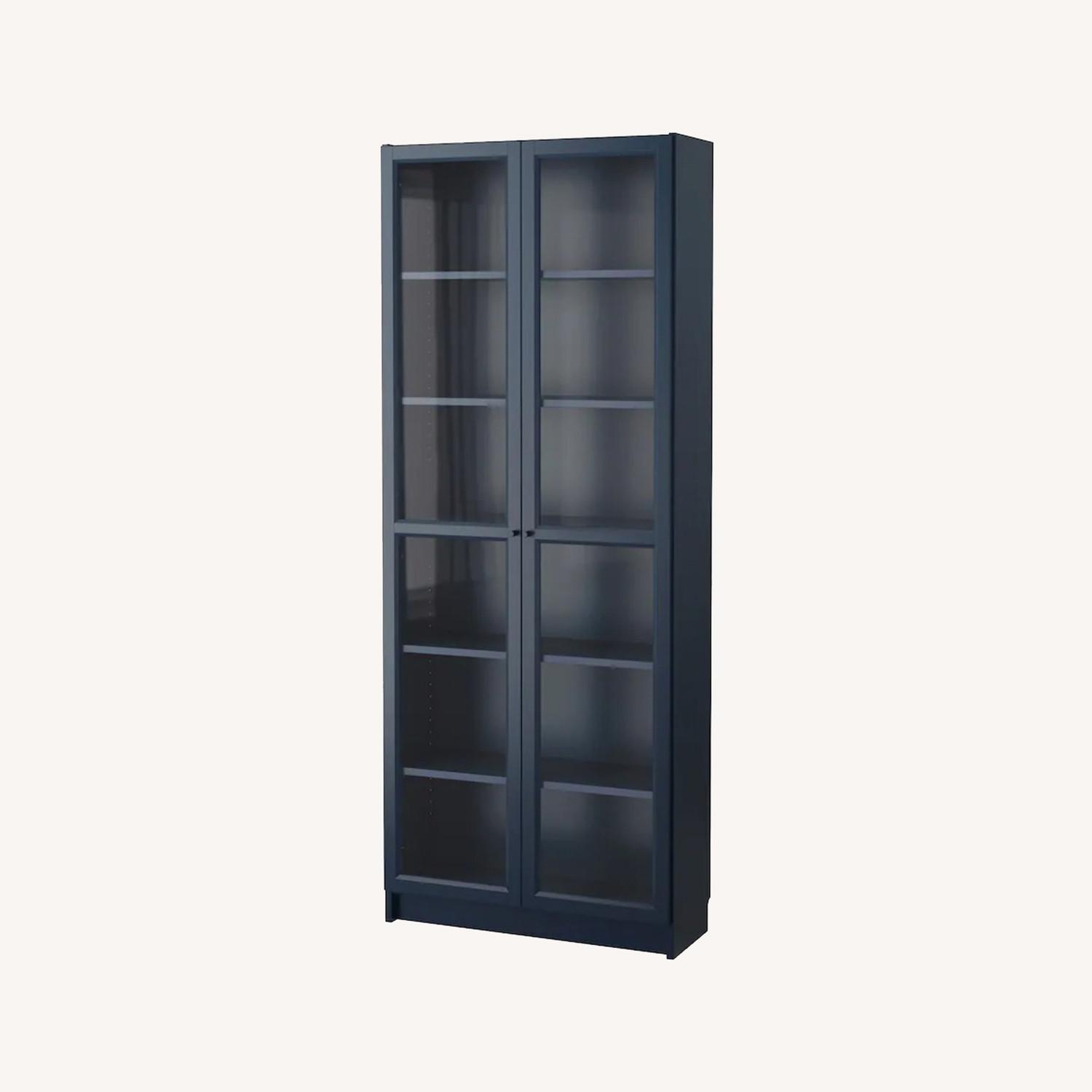 IKEA Billy Bookcase with Glass Doors in Navy Blue - image-0
