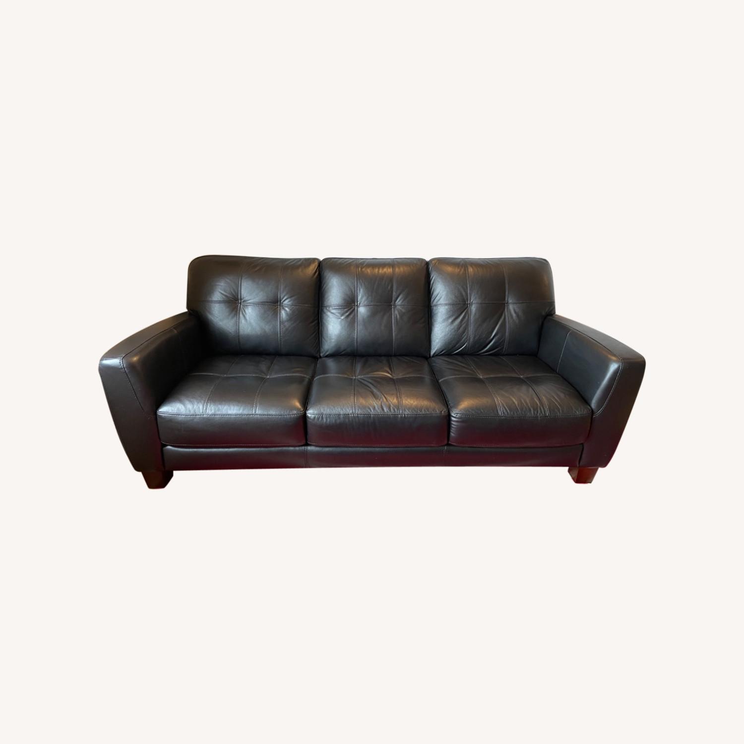 Raymour and Flanigan Black Leather Couch AptDeco