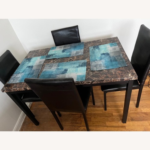 Used Modern Dining Table with 4 Chairs for sale on AptDeco
