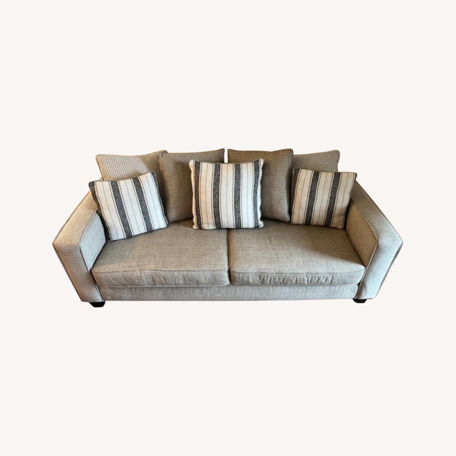 Rooms to Go Beige Sofa with Original Pillows AptDeco