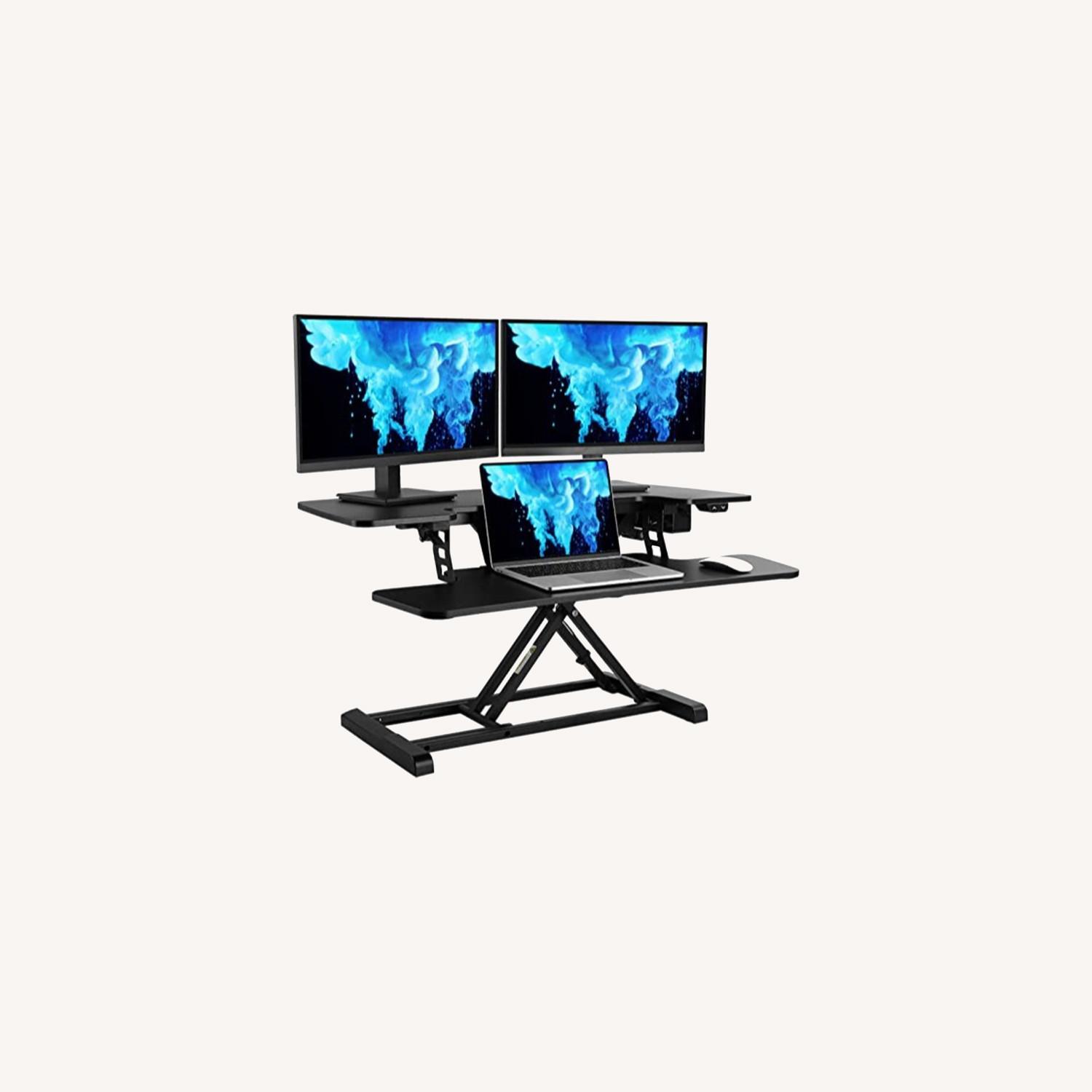 FlexiSpot Motorized Standing Desk Converter AptDeco