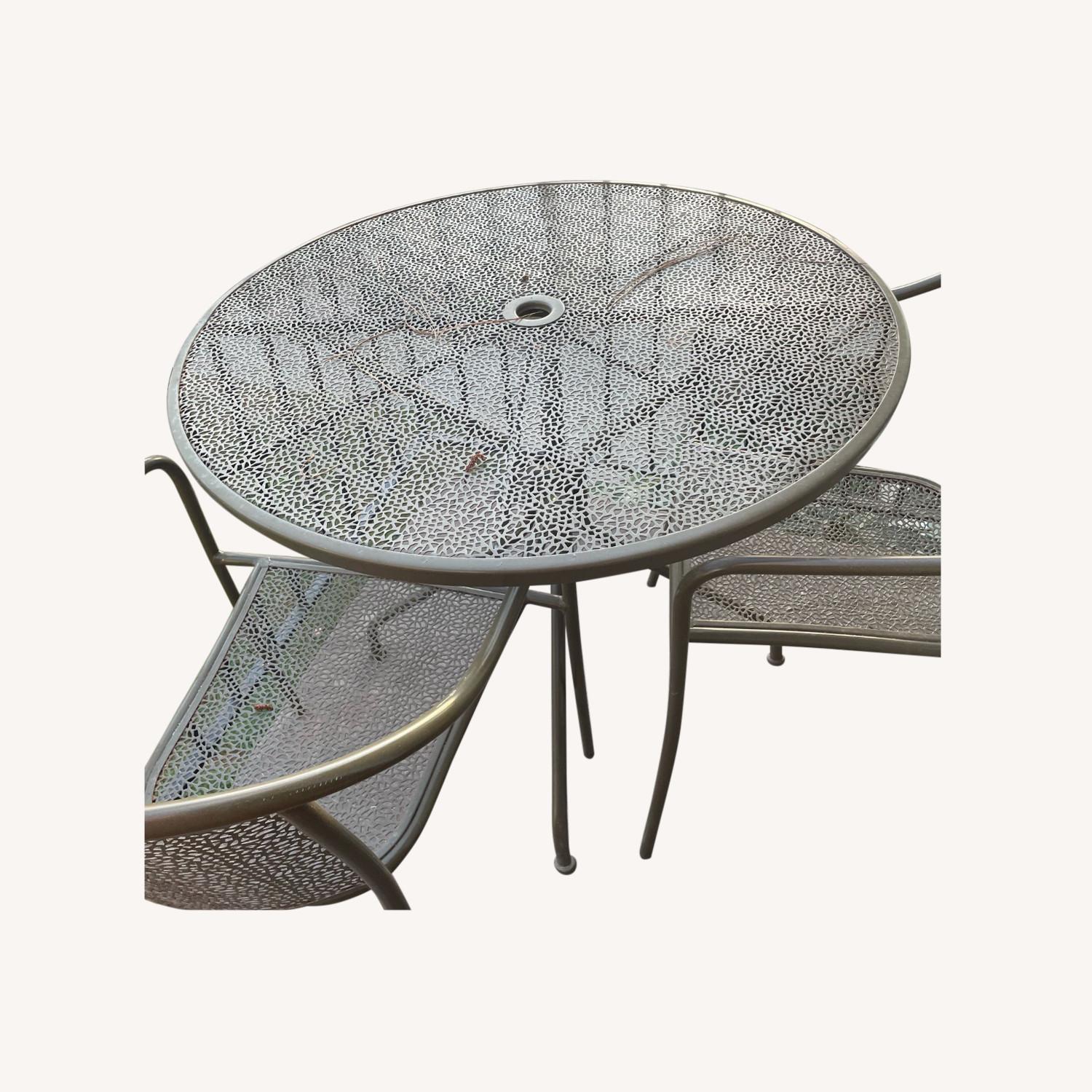 Ashley Furniture Patio Table and 4 Matching Chairs - image-0