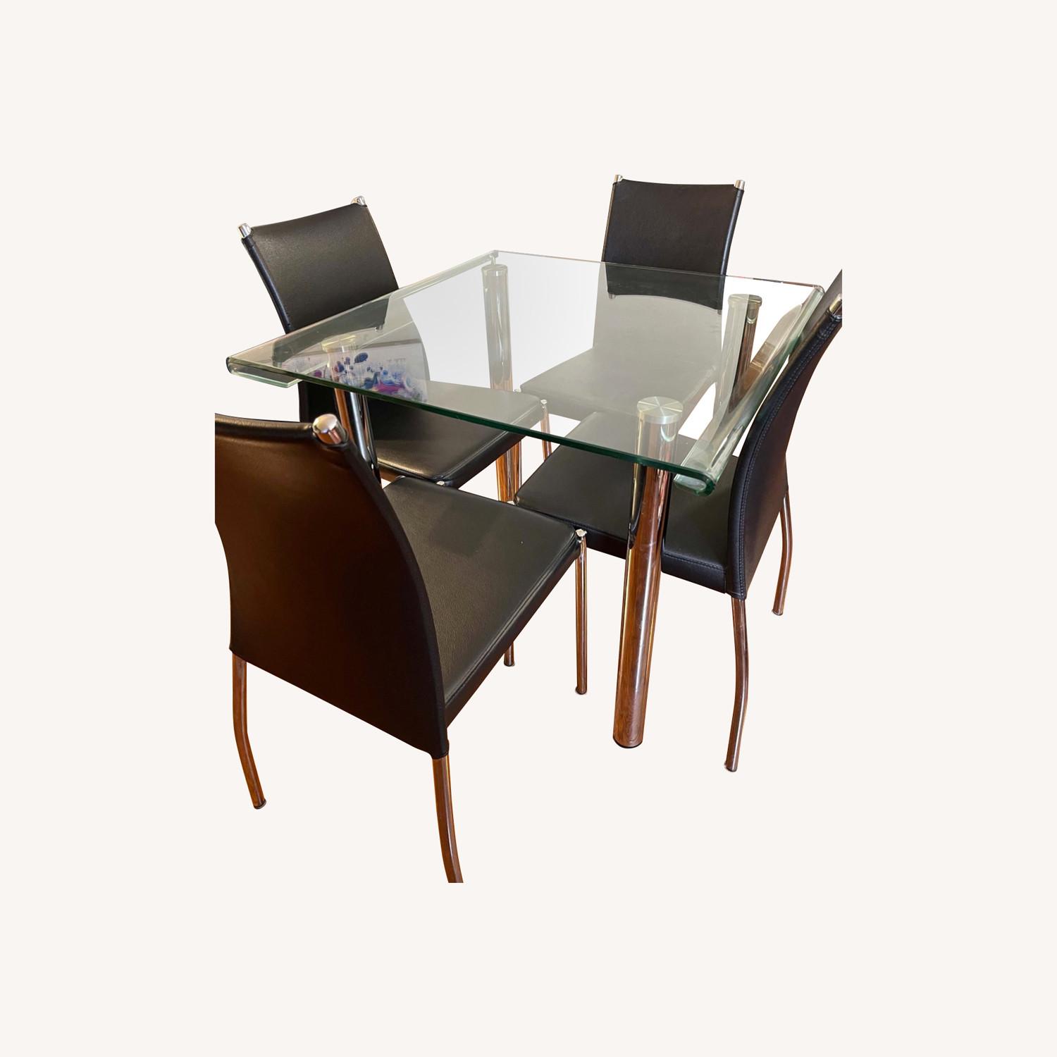 View of Raymour & Flanigan 4-Piece Glass Dining Set - AptDeco