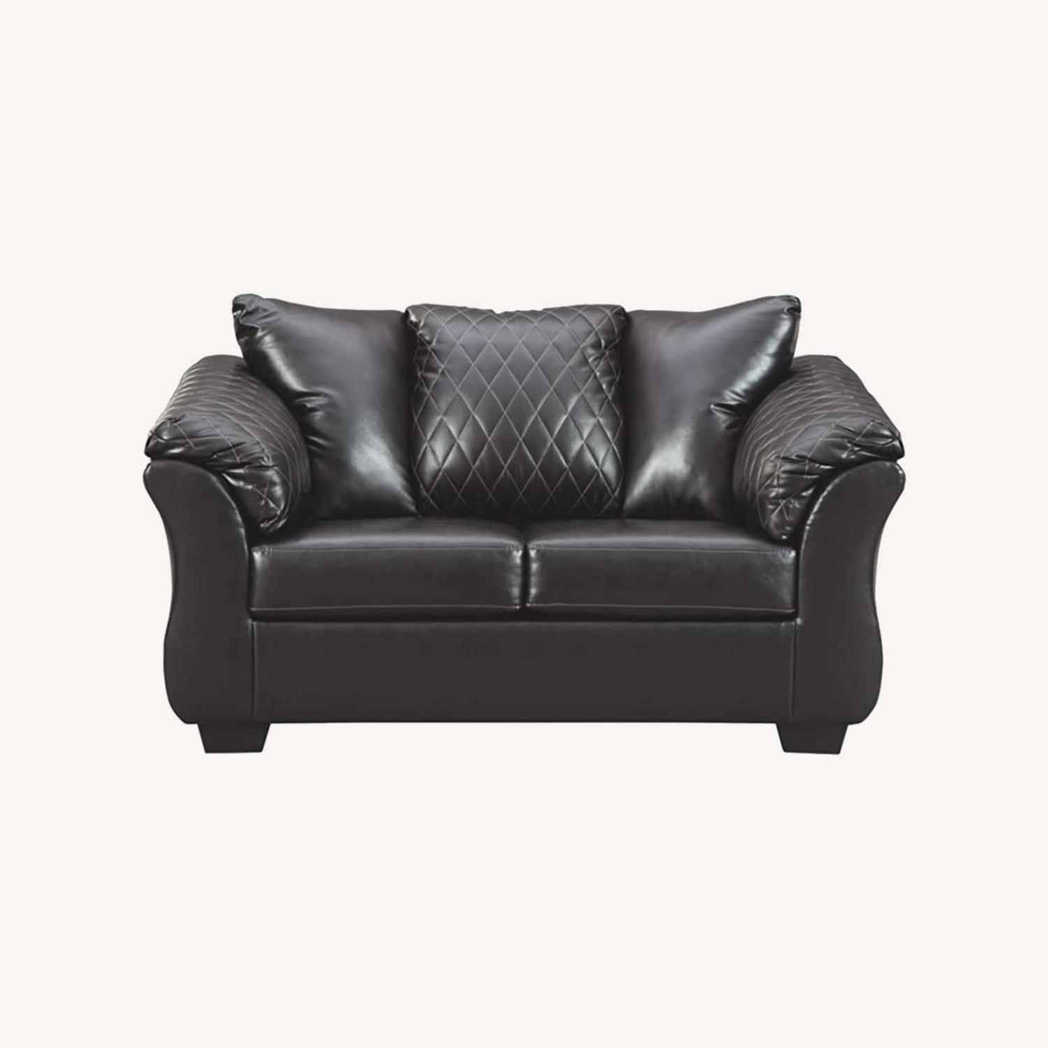 Signature Design Black Leather Loveseat Sofa AptDeco