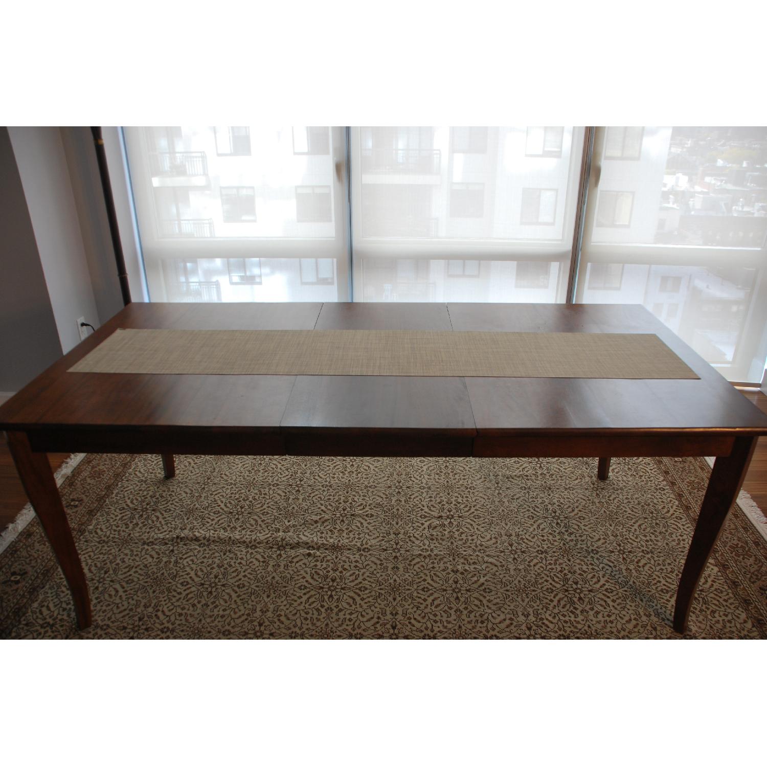 Crate & Barrel Cabria Honey Brown Extension Dining Table AptDeco