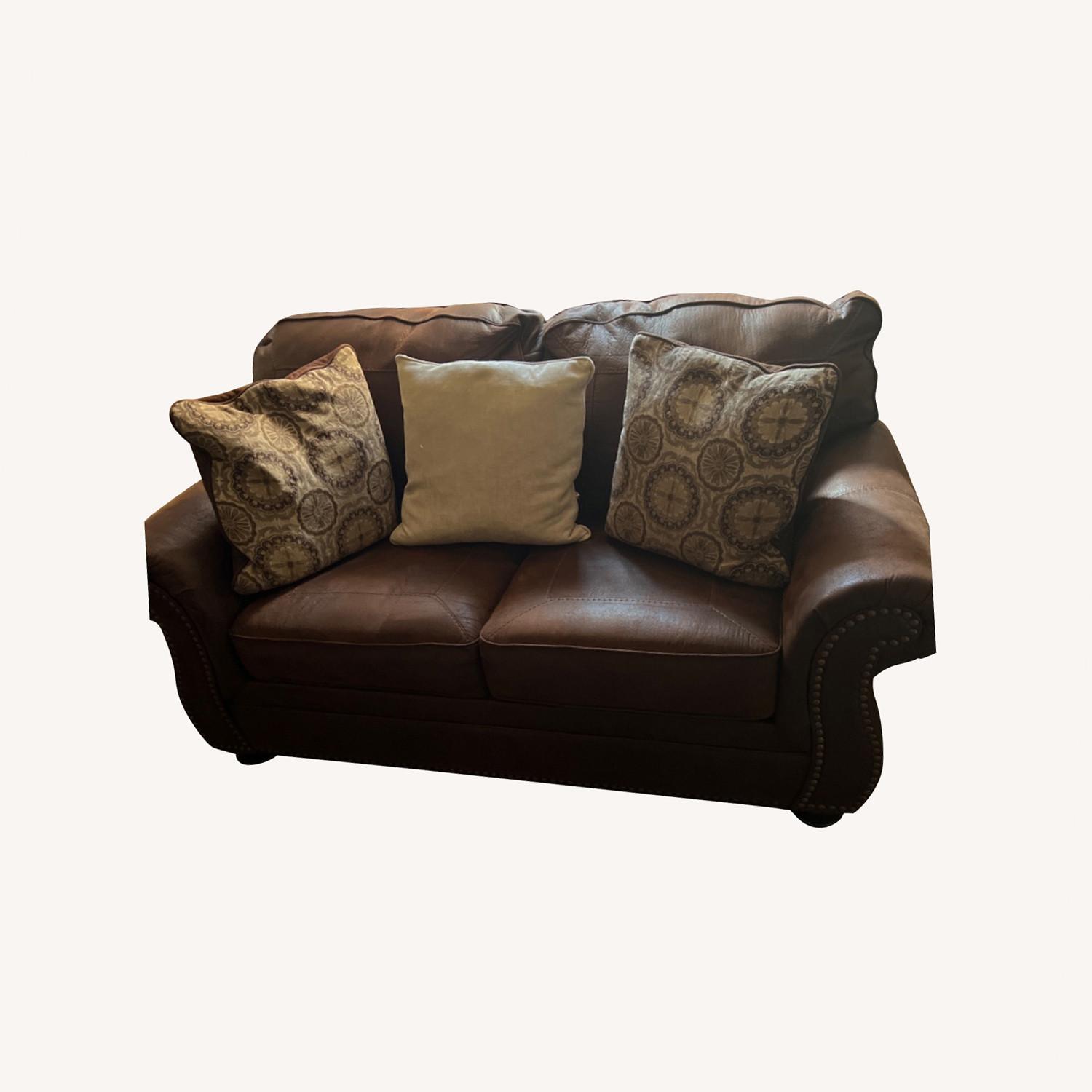 Ashley Furniture Dark Brown Loveseat - image-0