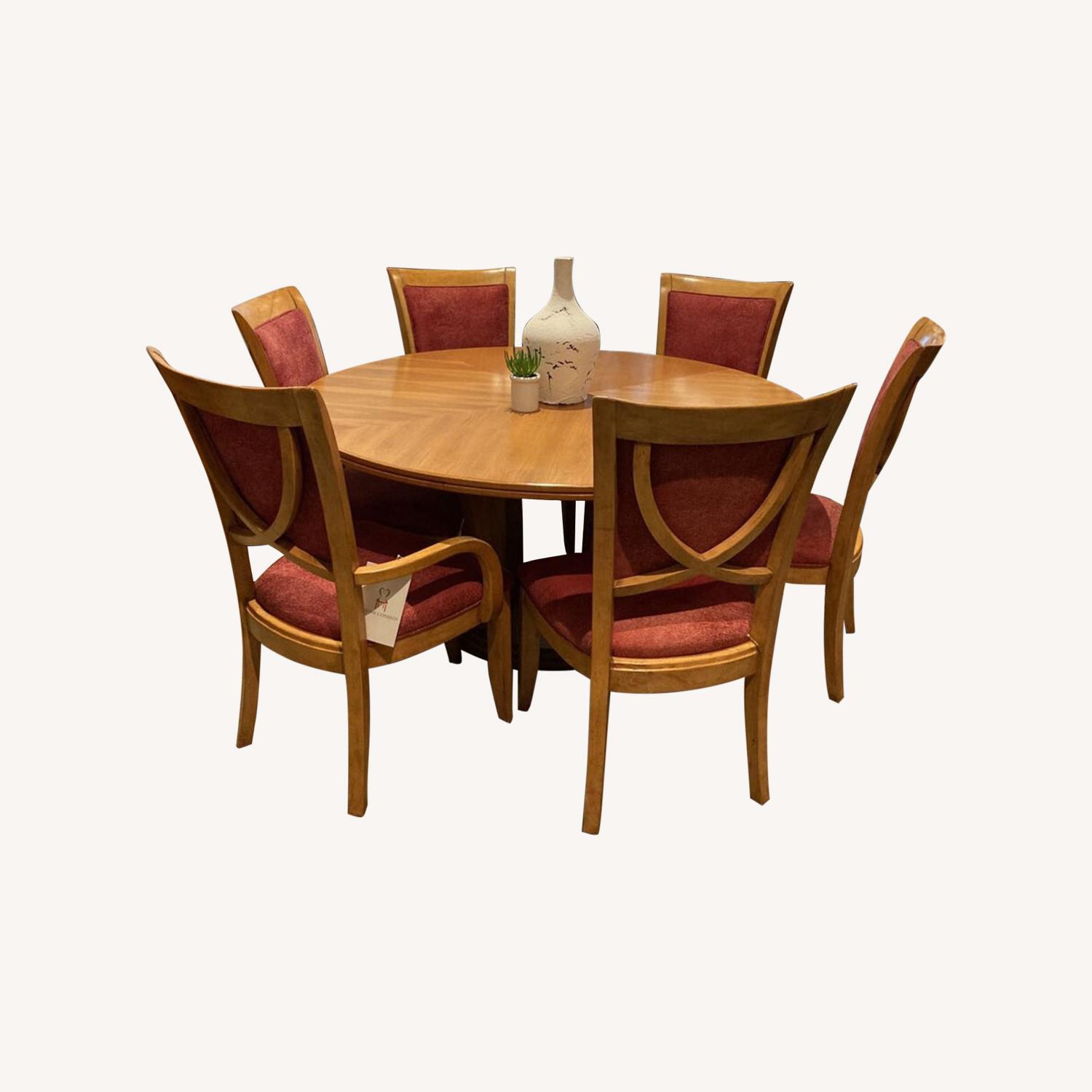Light Wood Pedestal Table With Decorative Center Round AptDeco