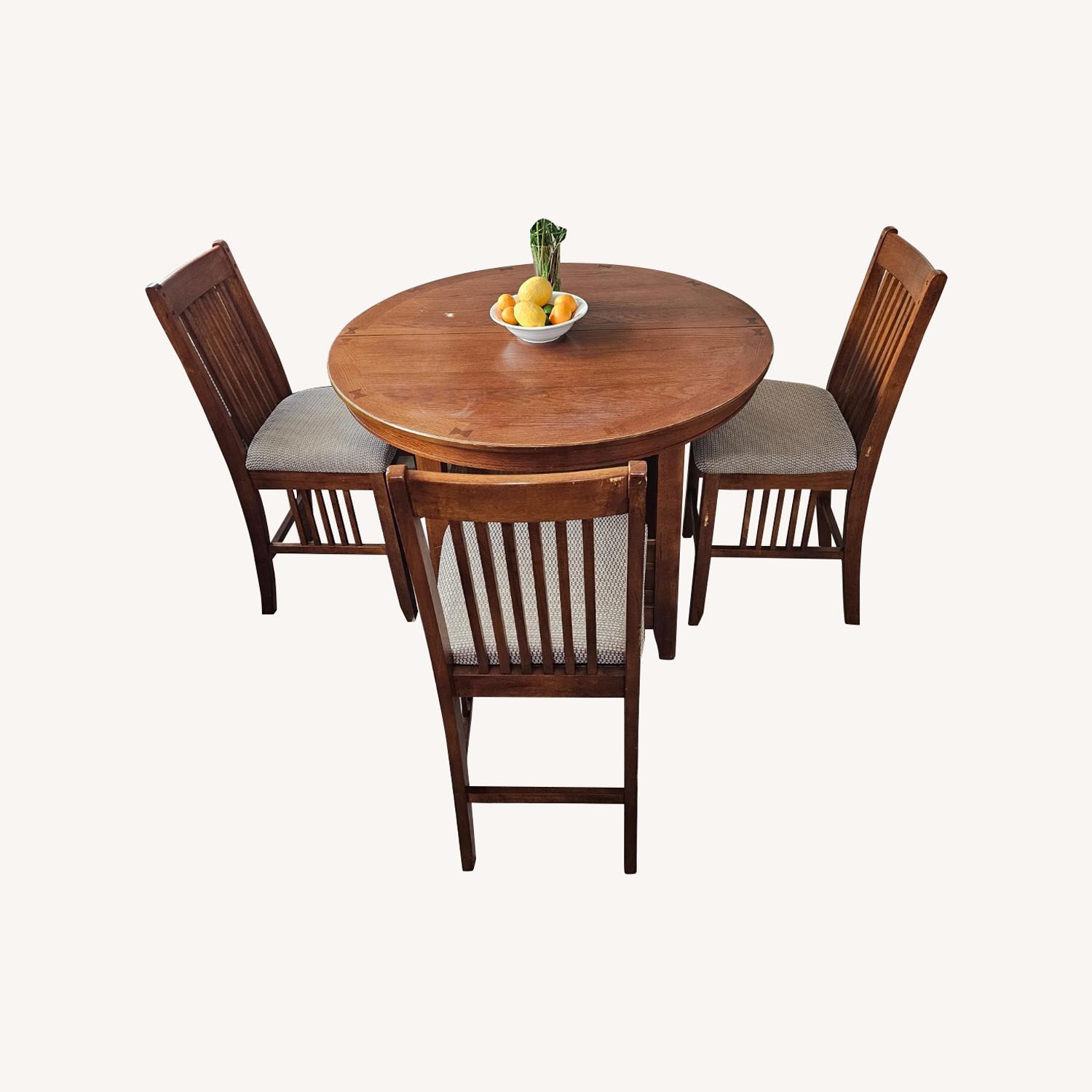 Round Extendable Dining Table + Chairs - image-0