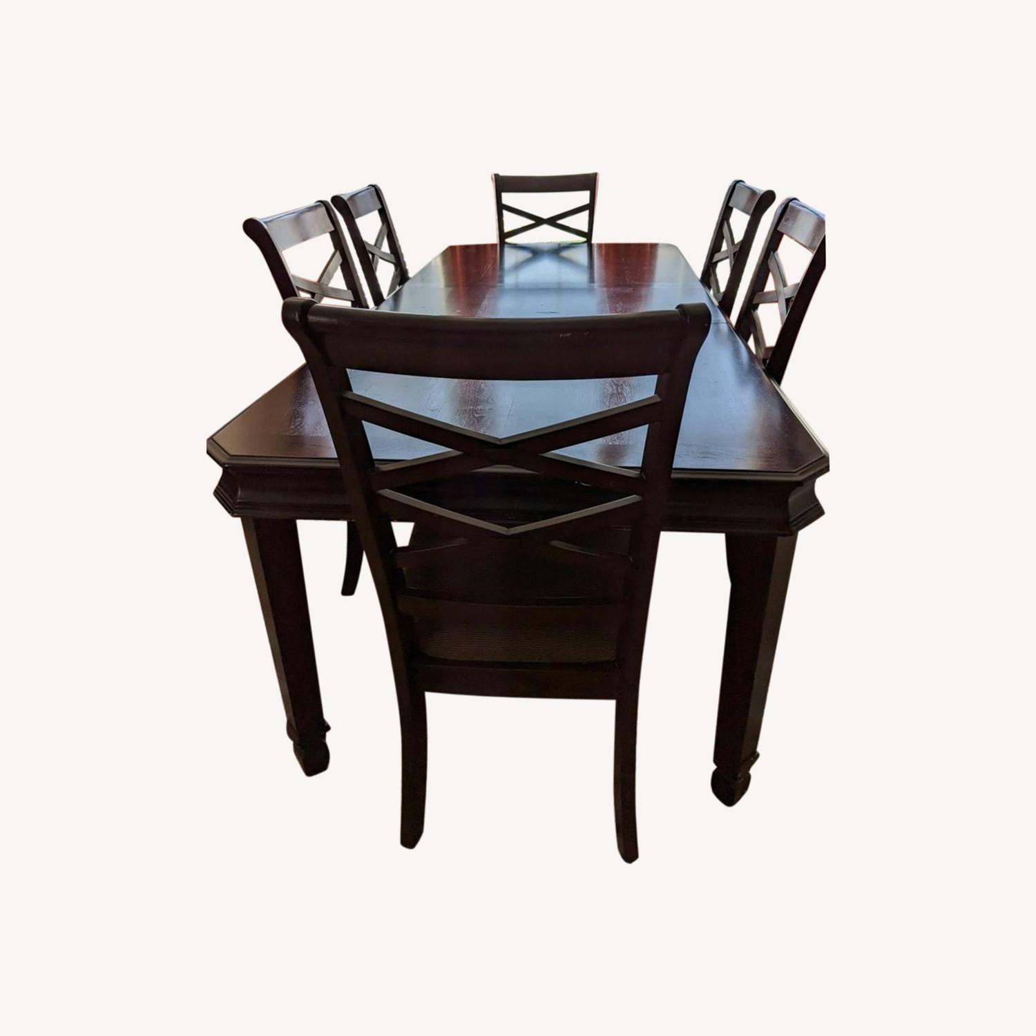 Raymour & Flanigan Solid Wood Dining Table with 6 Chairs AptDeco