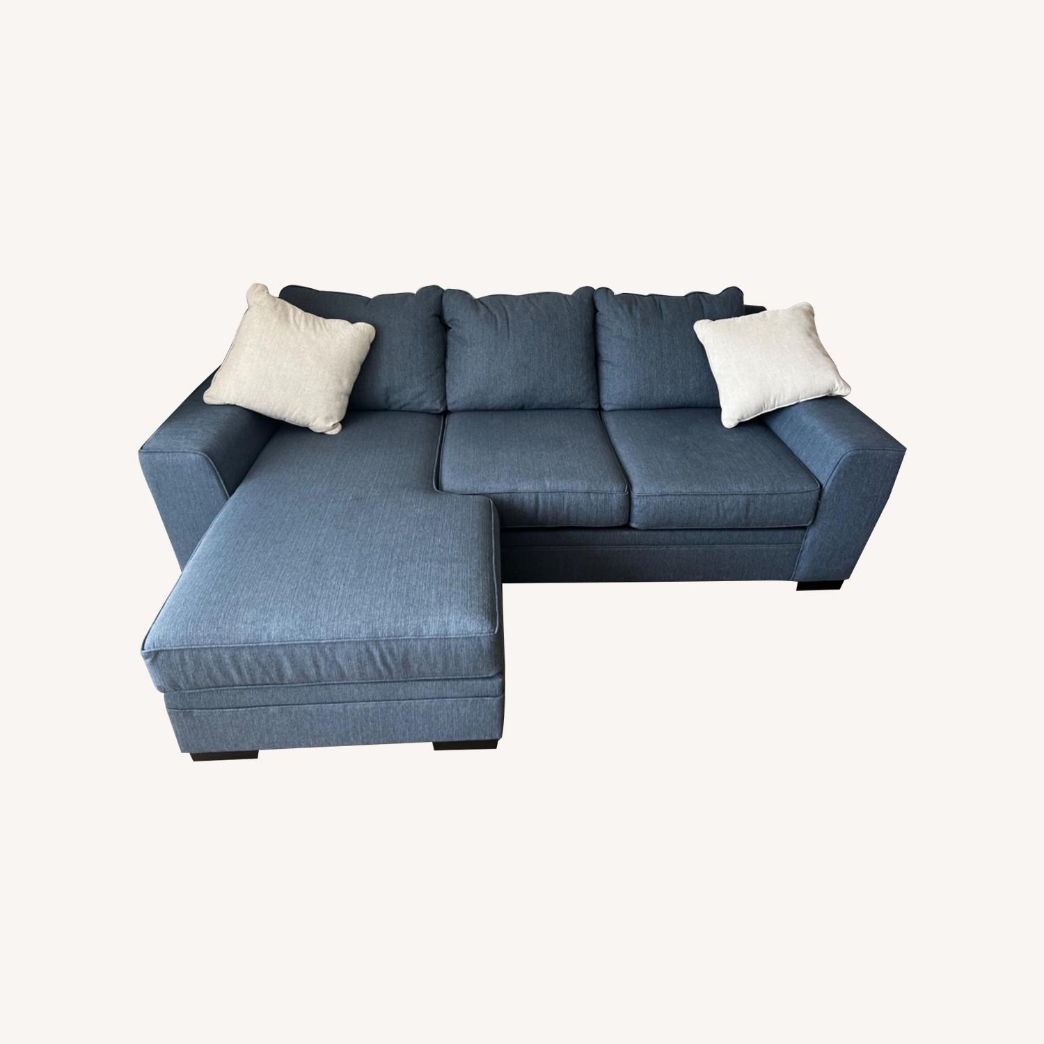 Living Spaces Reversible Chaise Lounge Sofa with Pillows - image-0
