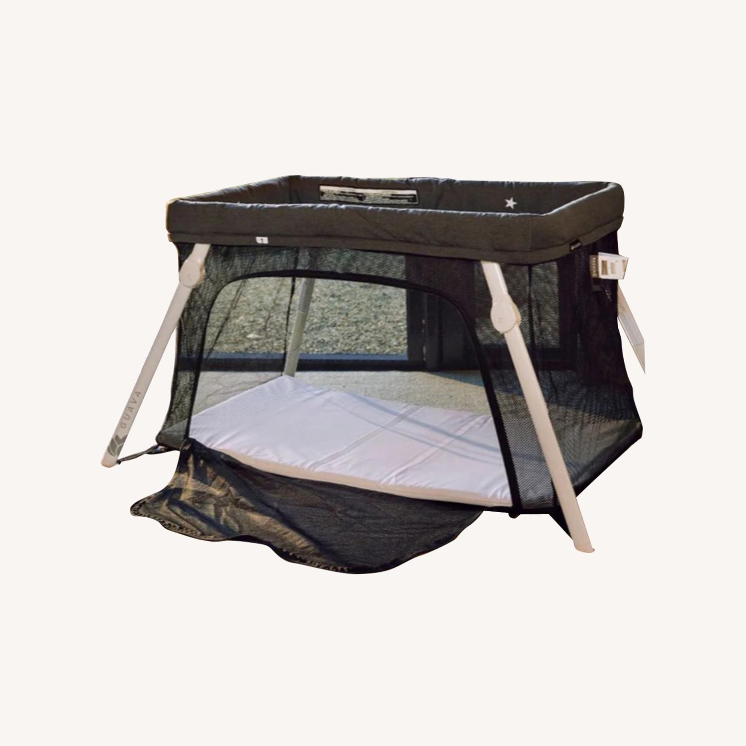 Lotus Travel Crib AptDeco