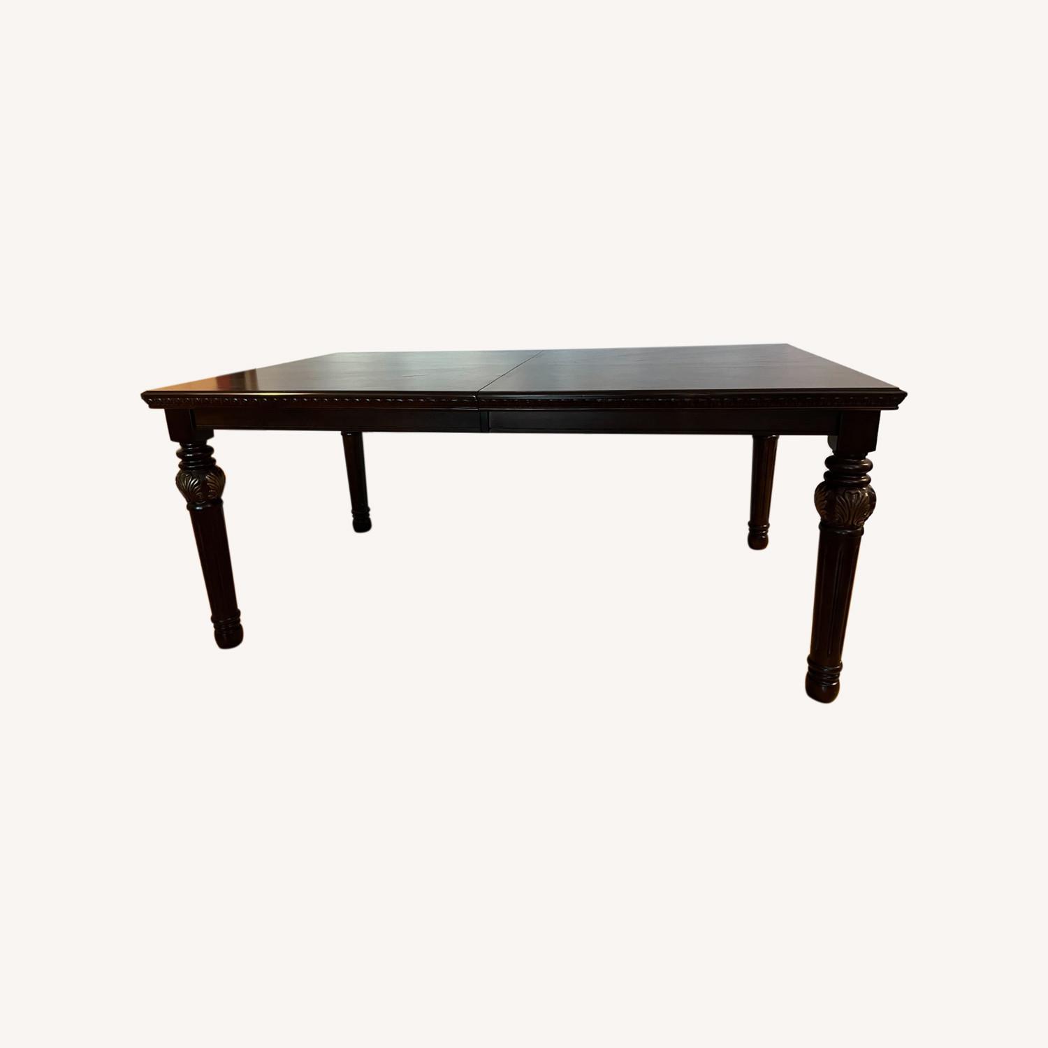 Ashley Furniture Extendable Dining Table - image-0