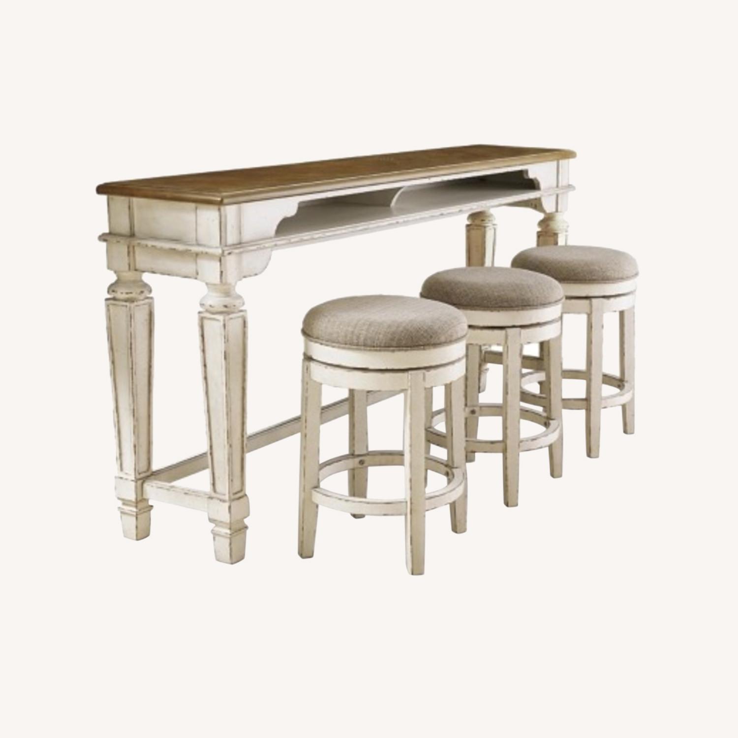 Ashley Realyn Counter Height Table With 3 Stools - image-0