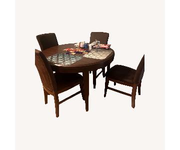 Round Dining Table with 4 Upholstered Chairs - AptDeco
