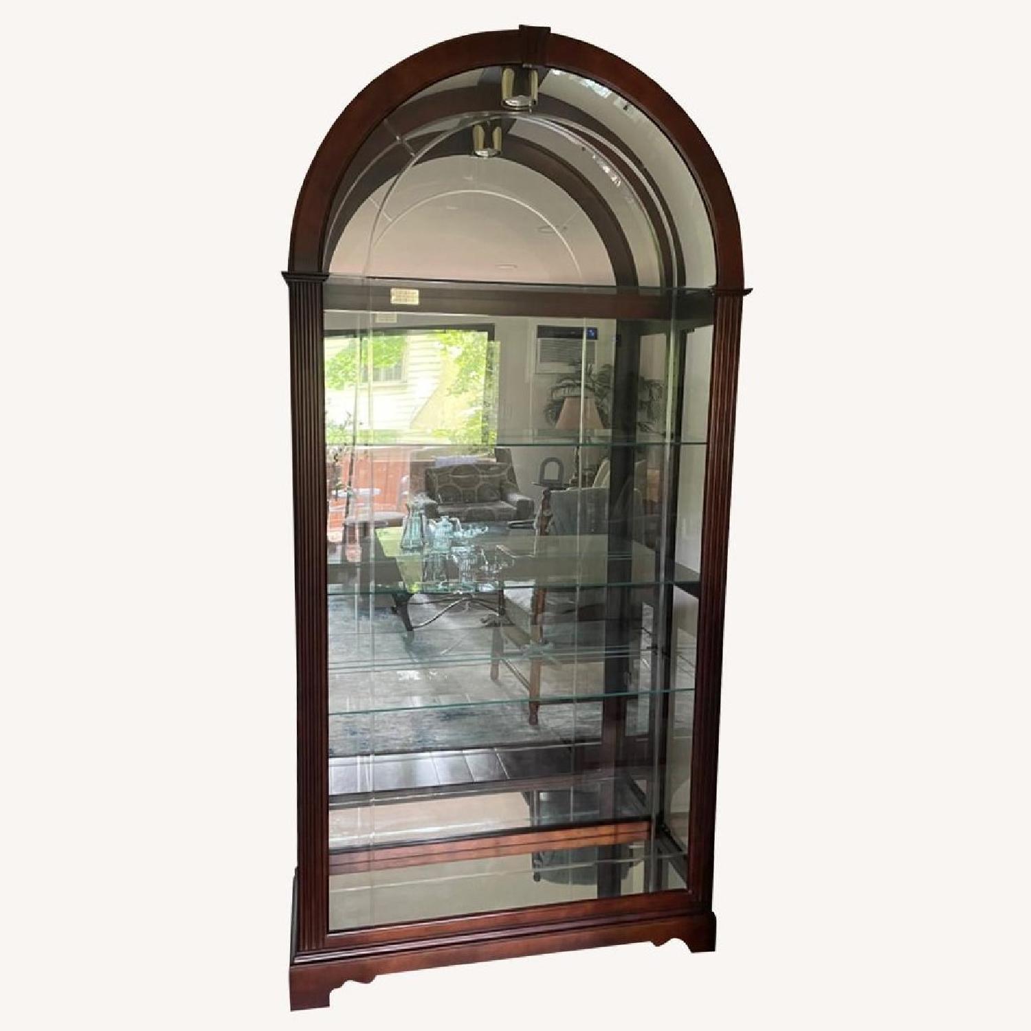 Howard Miller Arched Cherry/Glass Curio Cabinet - image-0