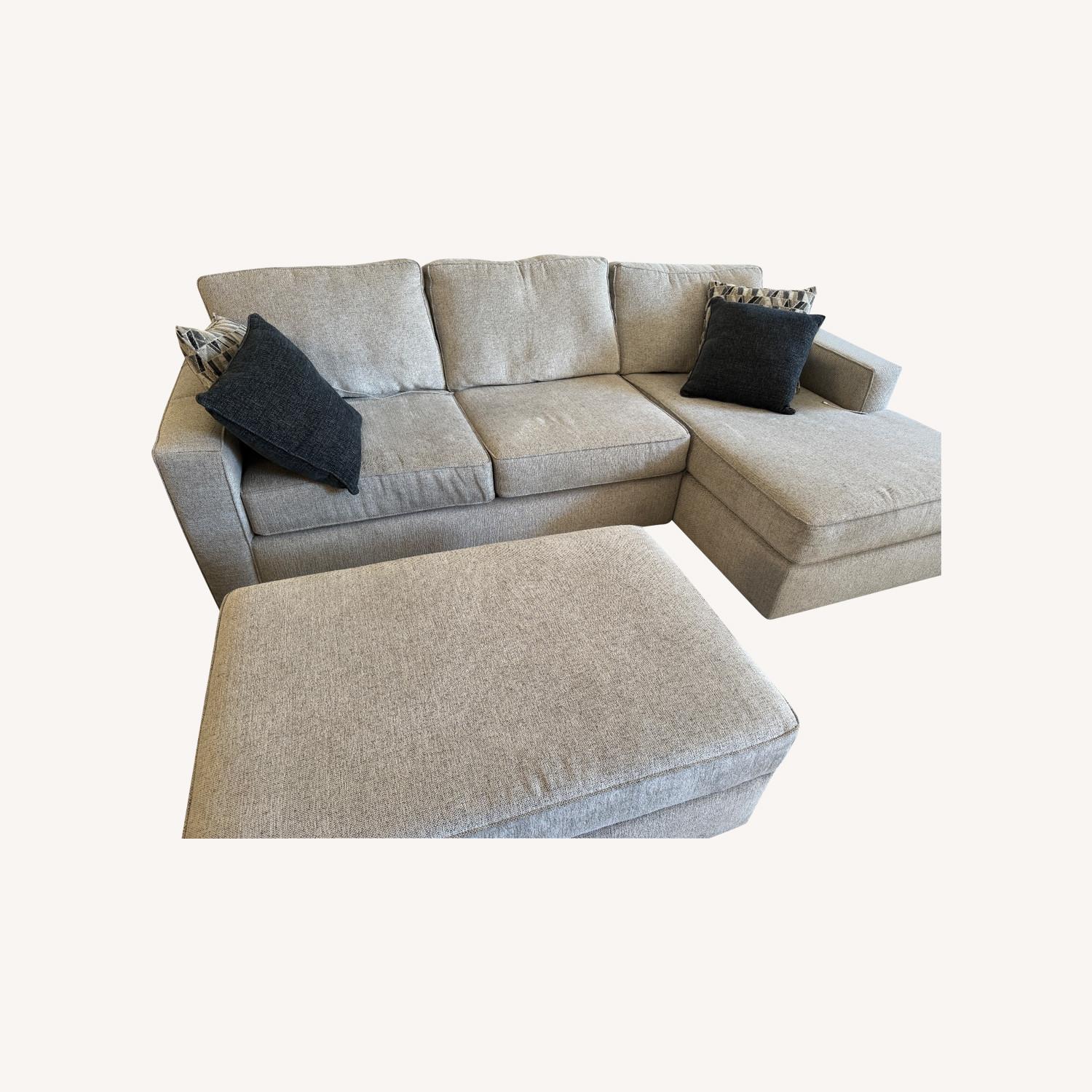 Living Spaces Sofa with Chaise and Ottoman - image-0