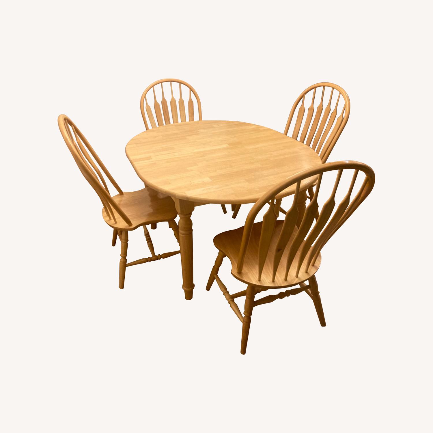 Ashley Furniture Solid Wood Dining Table W 4 Chairs and Leaf - image-0