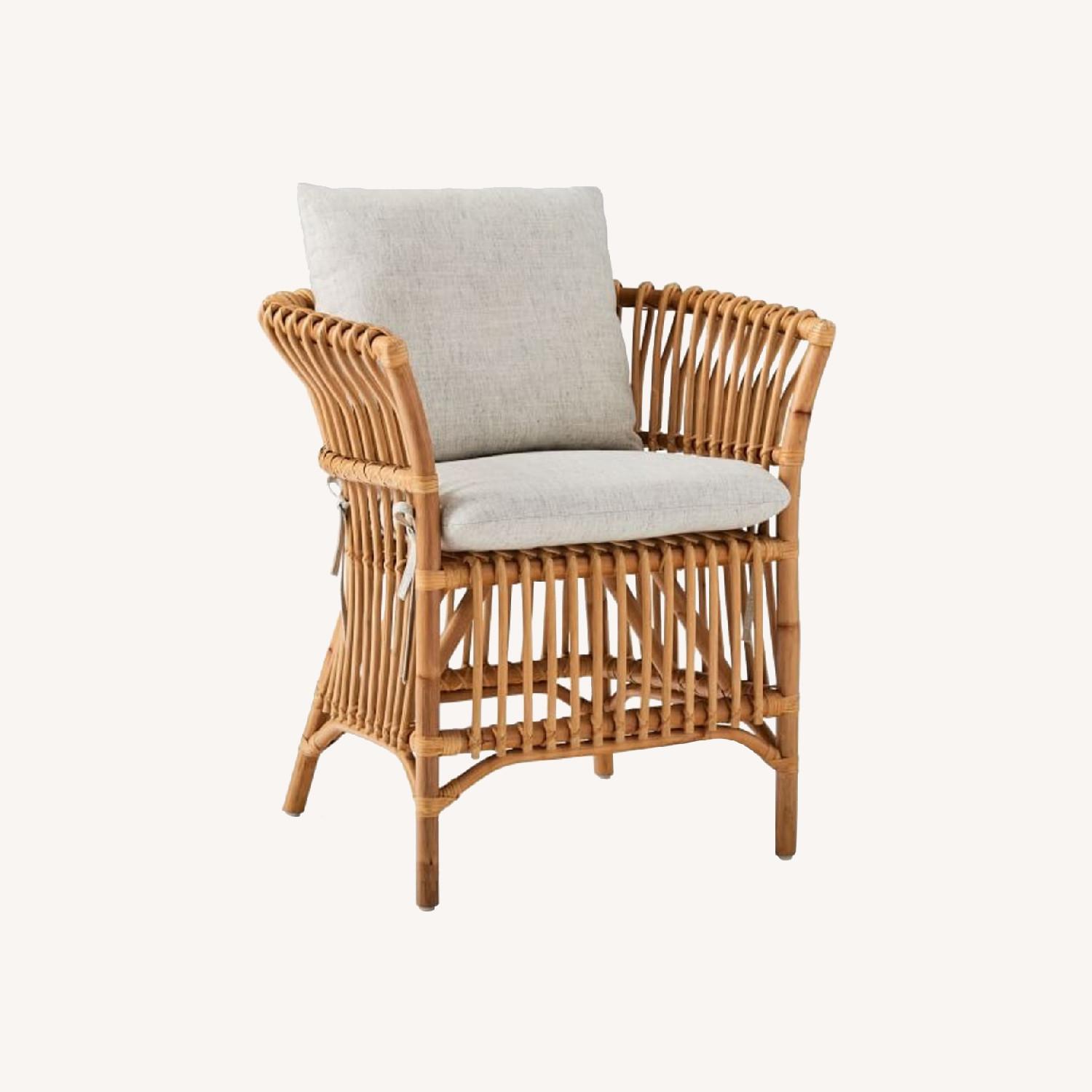 West Elm Rattan Chair with Linen Cushion - AptDeco