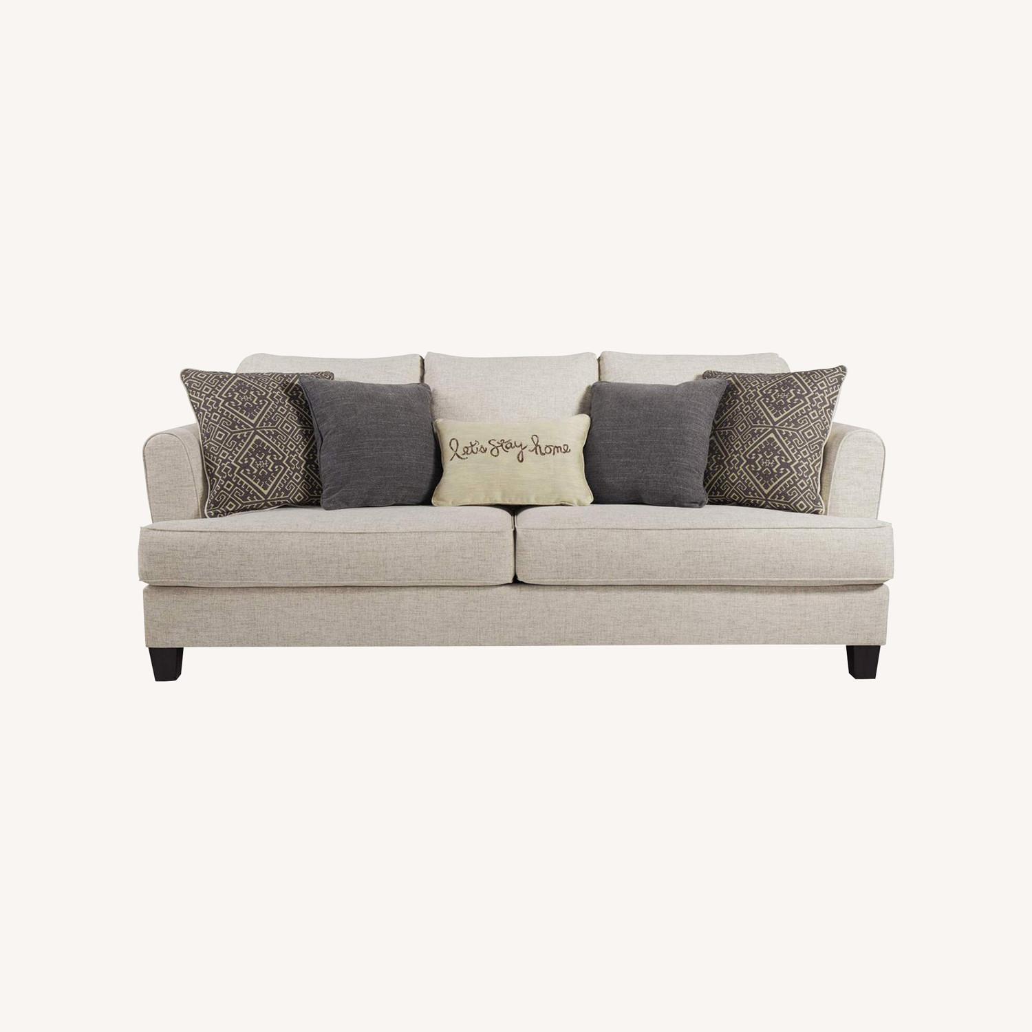 Ashley Furniture Alcona Beige Couch AptDeco