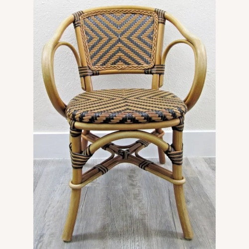 Used Vintage Bistro Style Rattan Arm Chair for sale on AptDeco