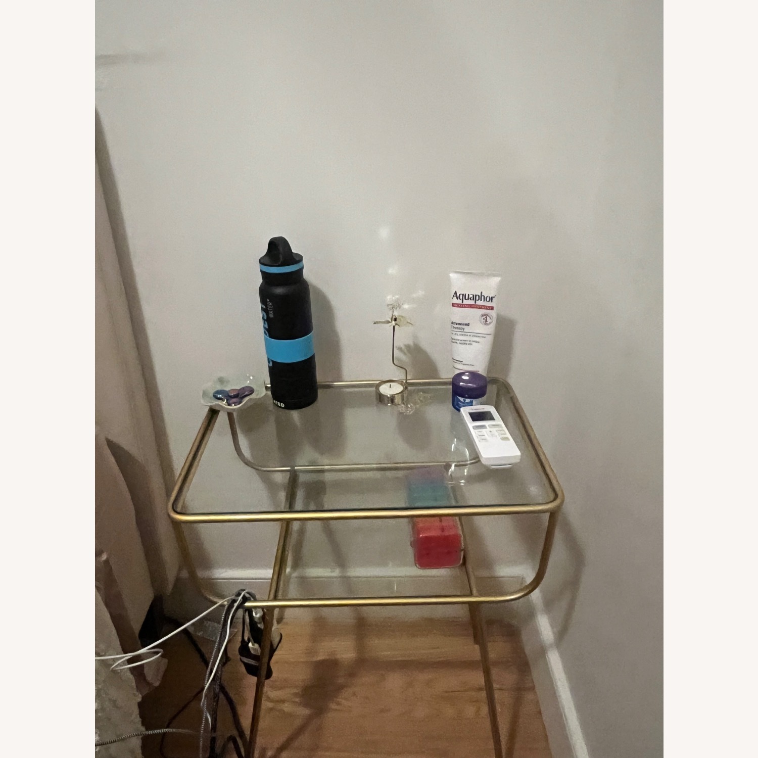 Glass Nightstand with Gold Accents - image-1