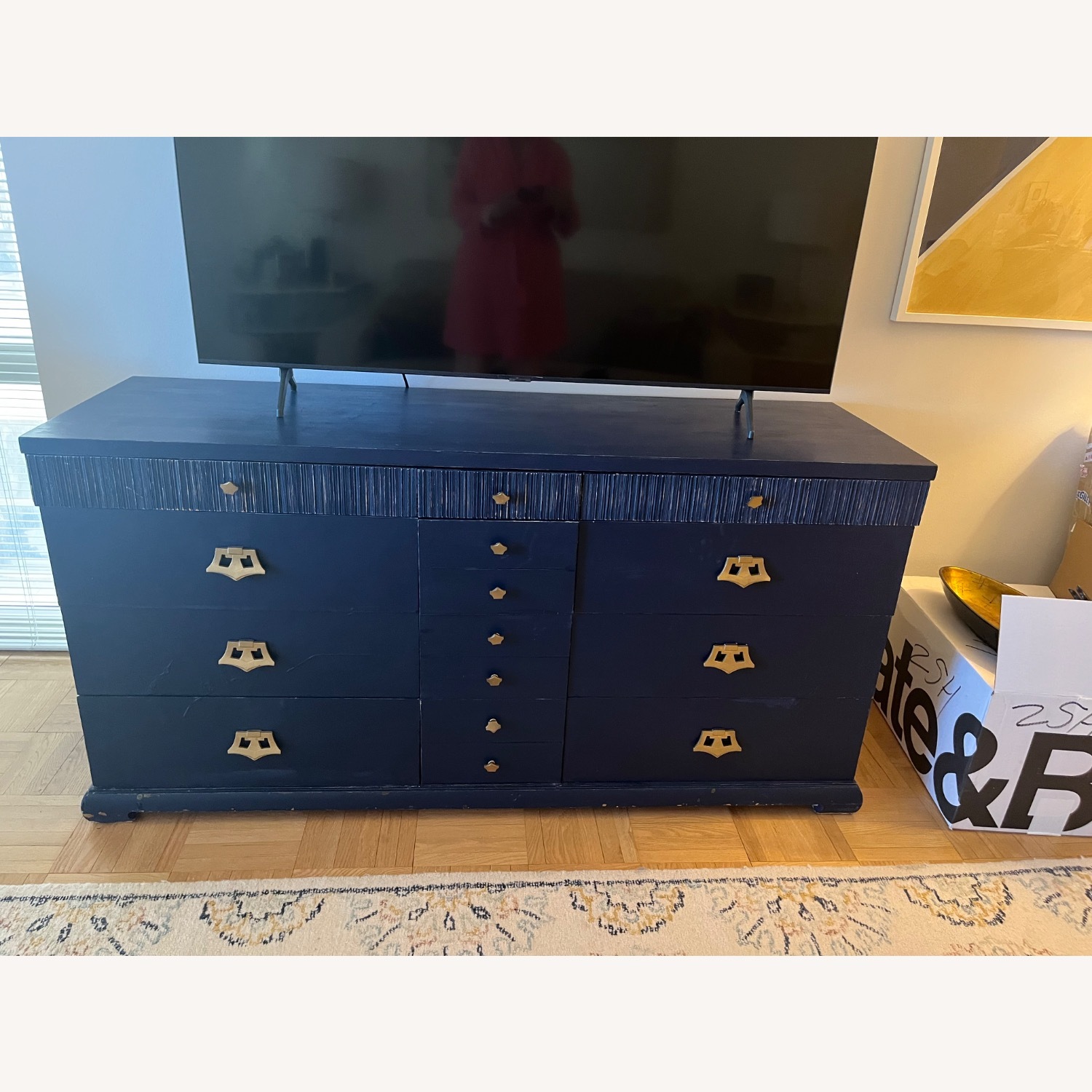 Vintage blue dresser with brass knobs - AptDeco Vintage blue dresser with brass knobs - AptDeco
