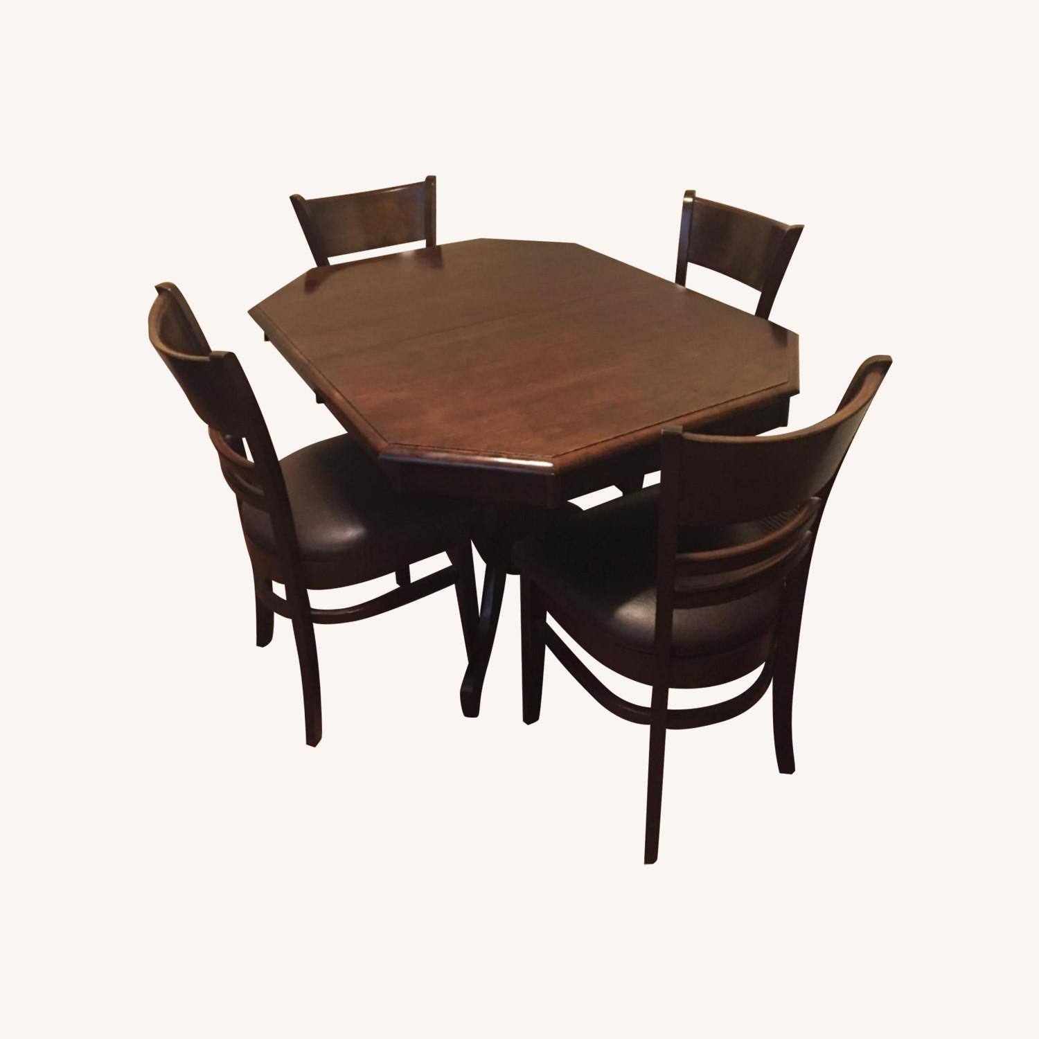 Dark Brown Wood Table with Leather Cushion Chairs - image-0