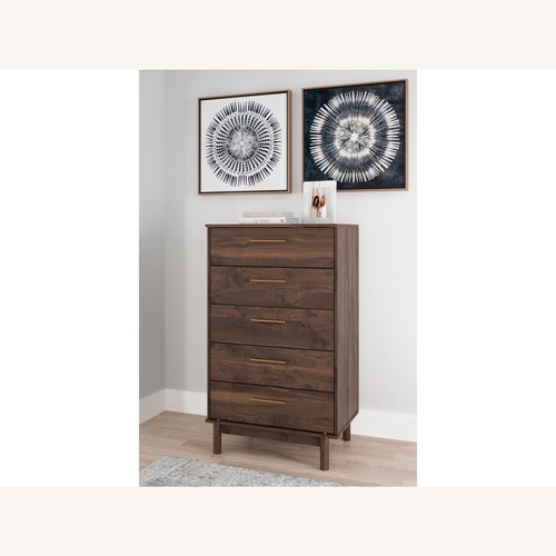 Used Ashley Furniture Calverson Chest for sale on AptDeco