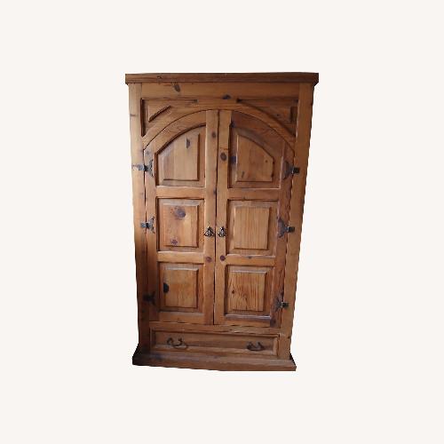 Used Rustic Cathedral Style Solid Wood Armoire  for sale on AptDeco