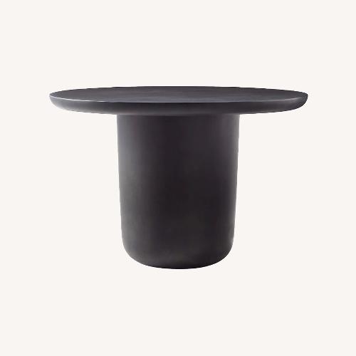 Used CB2 Lola 45" Round Black Concrete Dining Table for sale on AptDeco