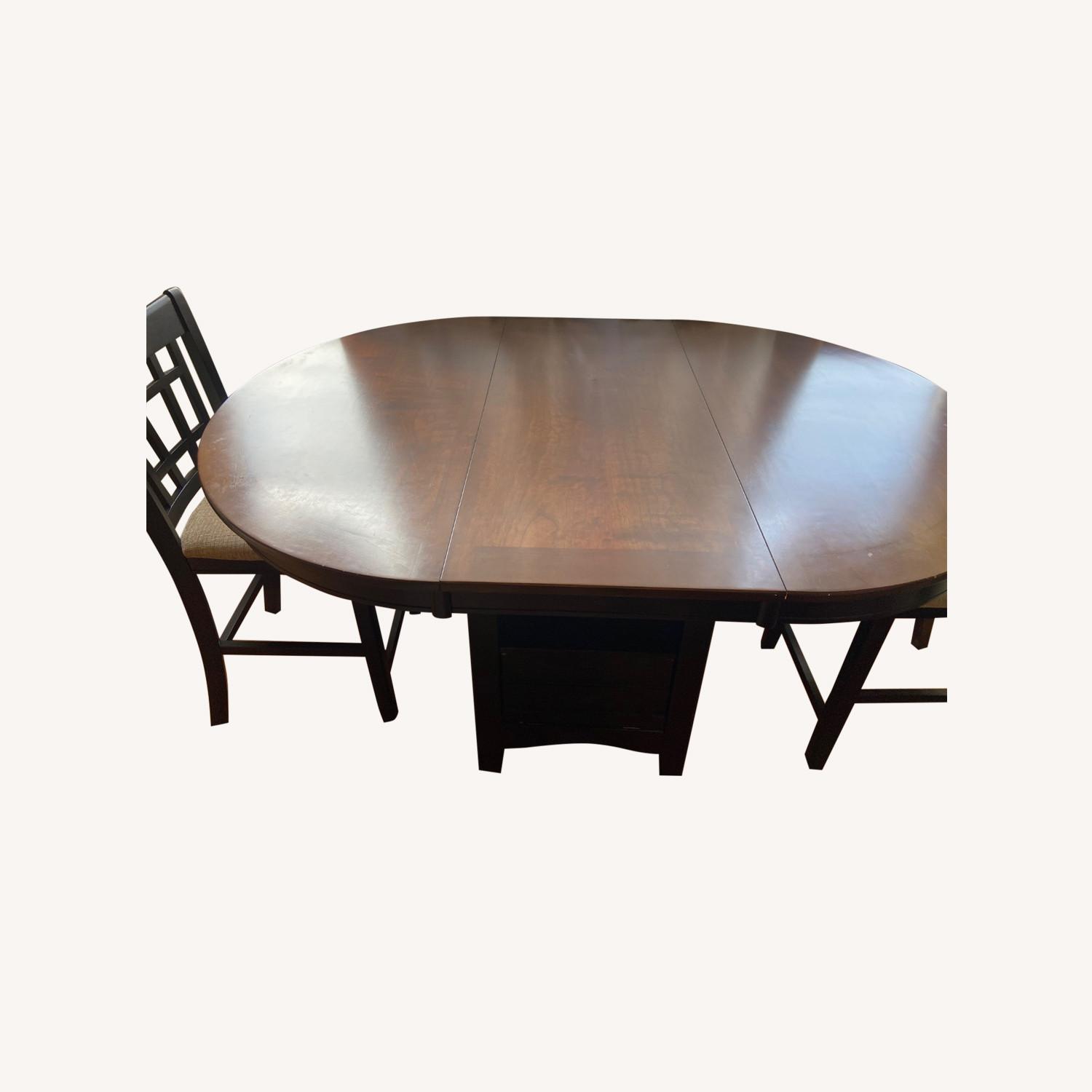 Dark Brown Wooden Table with Chairs - image-0