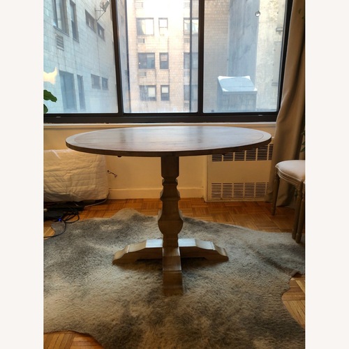 Used Pier 1 Imports Bradding Stonewash Round Dining Table for sale on AptDeco