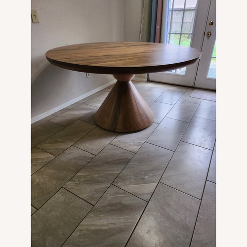 Used Round Wood Dining Table for sale on AptDeco