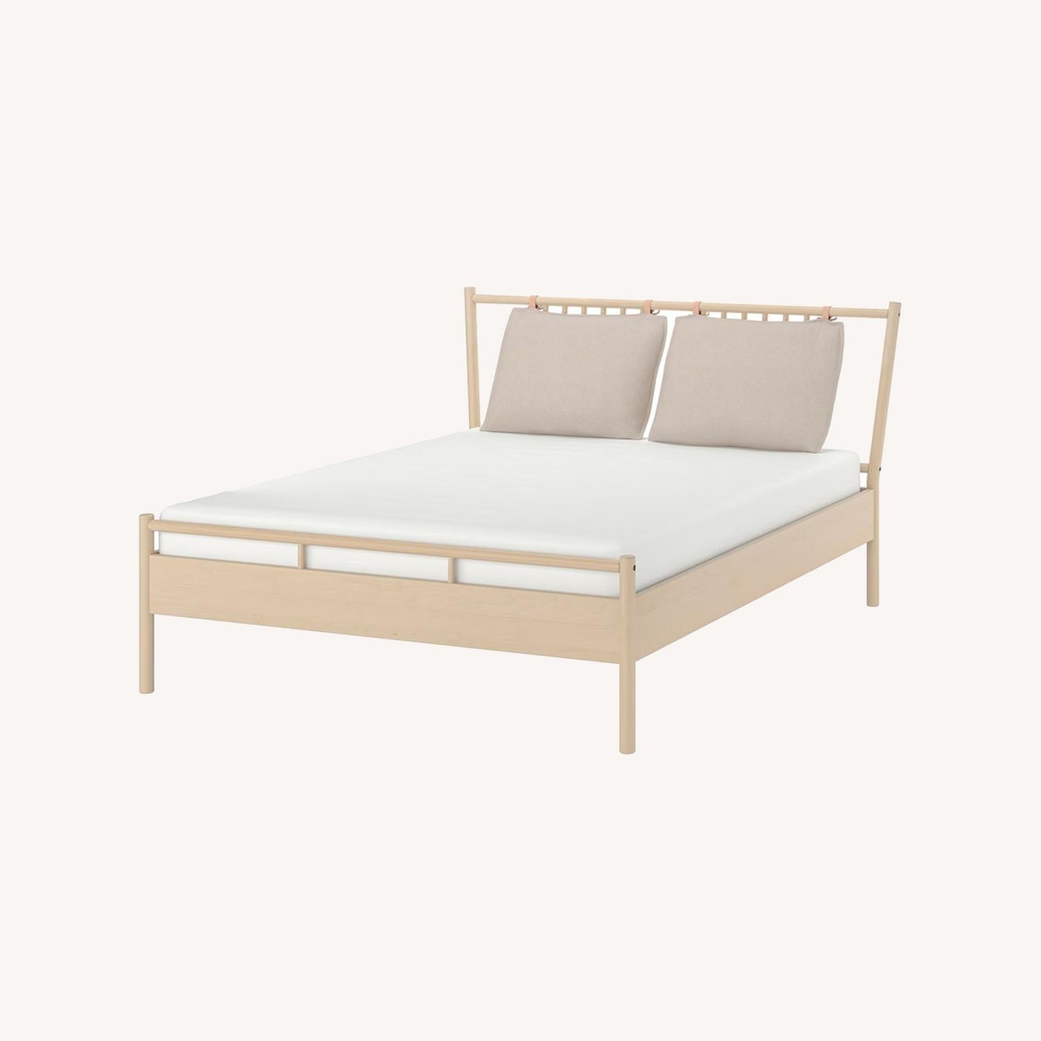 IKEA BJÖRKSNÄS Wood Queen Bed Frame - image-0