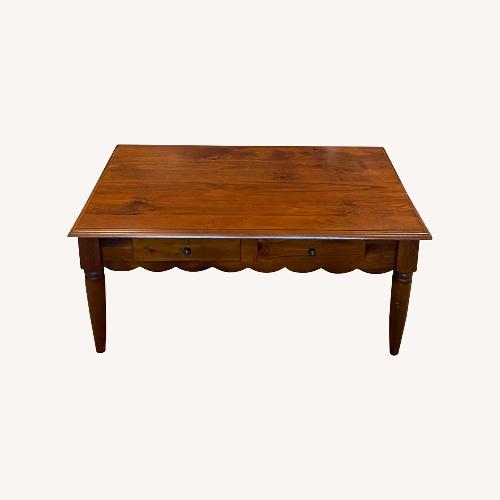 Used Scallop Edge Solid Wood Coffee Table with Drawers for sale on AptDeco