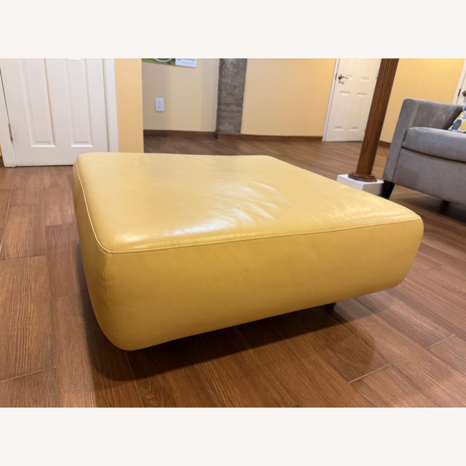 Design Within Reach Yellow Leather Ottoman on Wheels - image-3