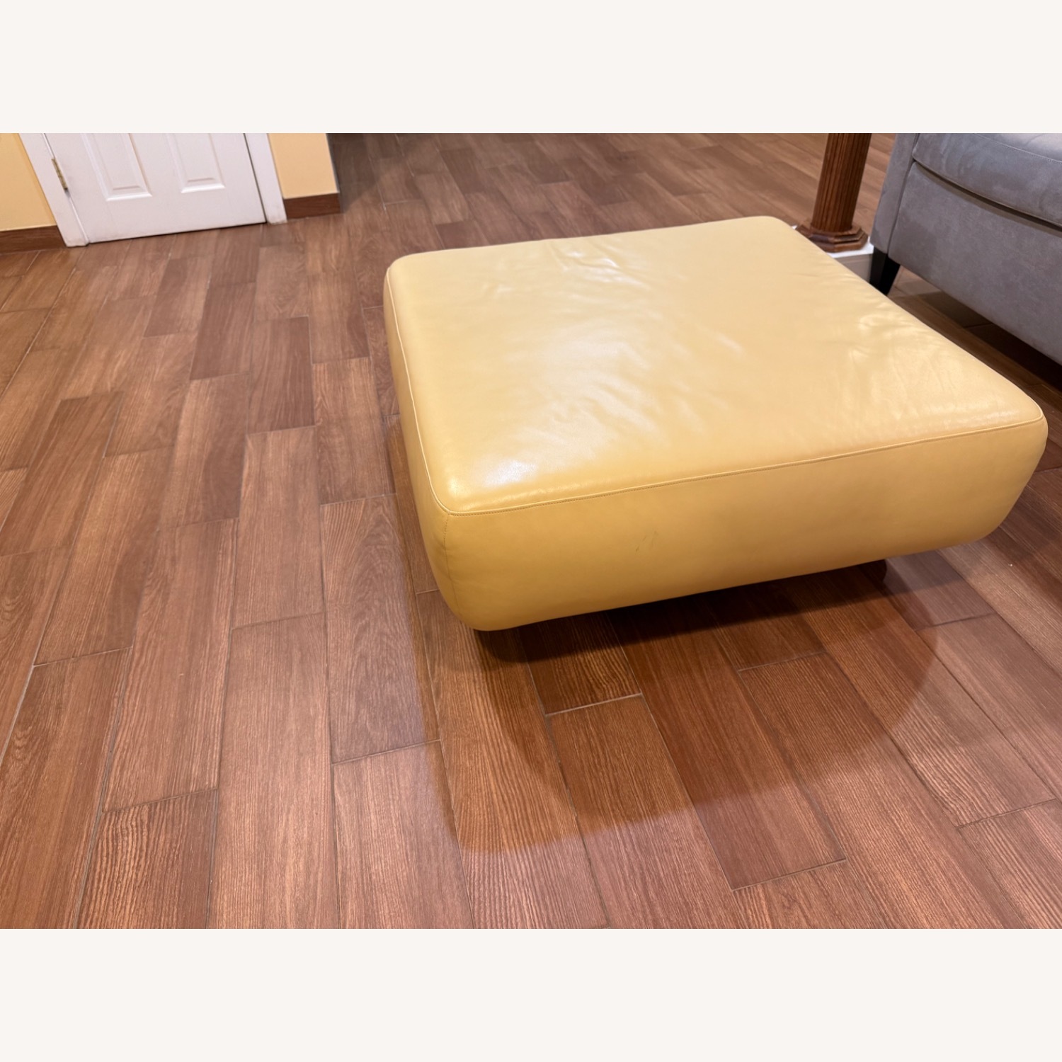 Design Within Reach Yellow Leather Ottoman on Wheels - image-1