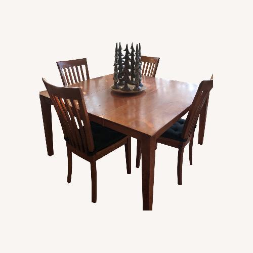 Used Solid Wood Dining Set with Butterfly Leaf  for sale on AptDeco
