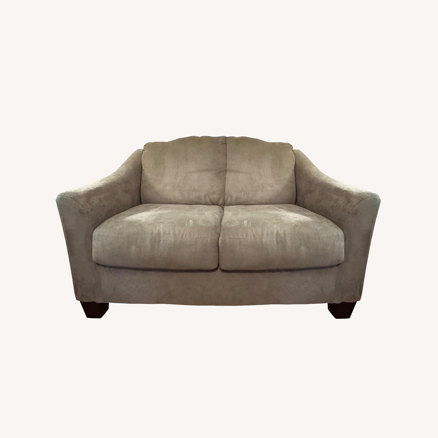 Ashley Furniture 56” Beige Loveseat - image-0