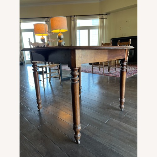 Used Wood Dining Table with Center Leaf for sale on AptDeco