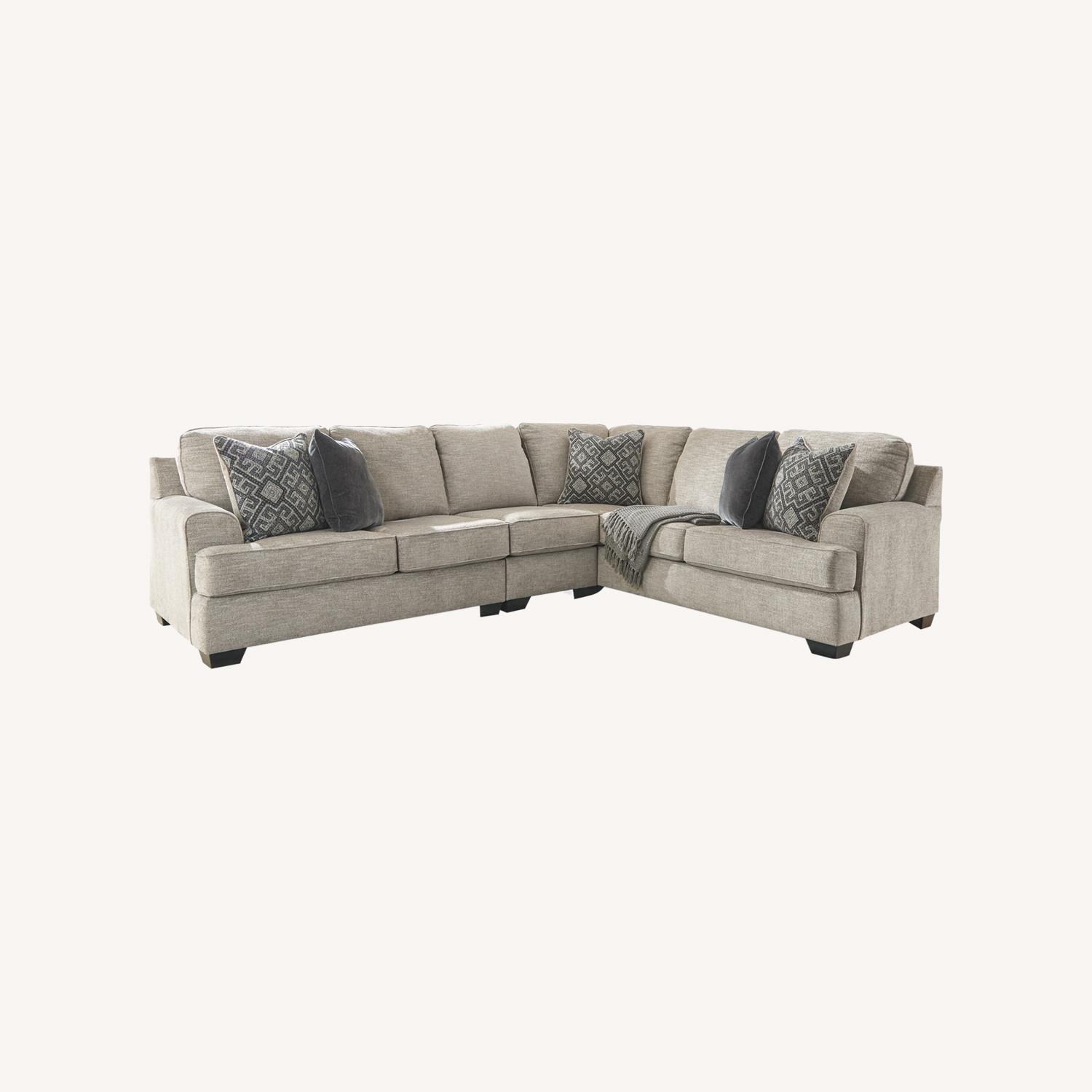 Ashley Furniture Sectional with Chaise and Ottoman  - image-0