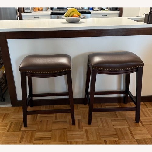 Used Pier1 Sawyer Leather Saddle Counter Stools for sale on AptDeco